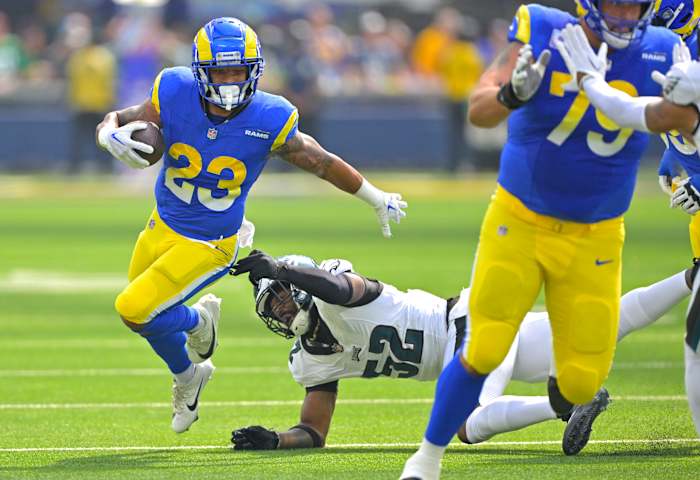 Oct 8, 2023; Inglewood, California, USA; Los Angeles Rams running back Kyren Williams (23) carries the ball past Philadelphia Eagles linebacker Zach Cunningham (52) in the first half at SoFi Stadium. Mandatory Credit: Jayne Kamin-Oncea-USA TODAY Sports